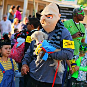 people in costume attending dog parade