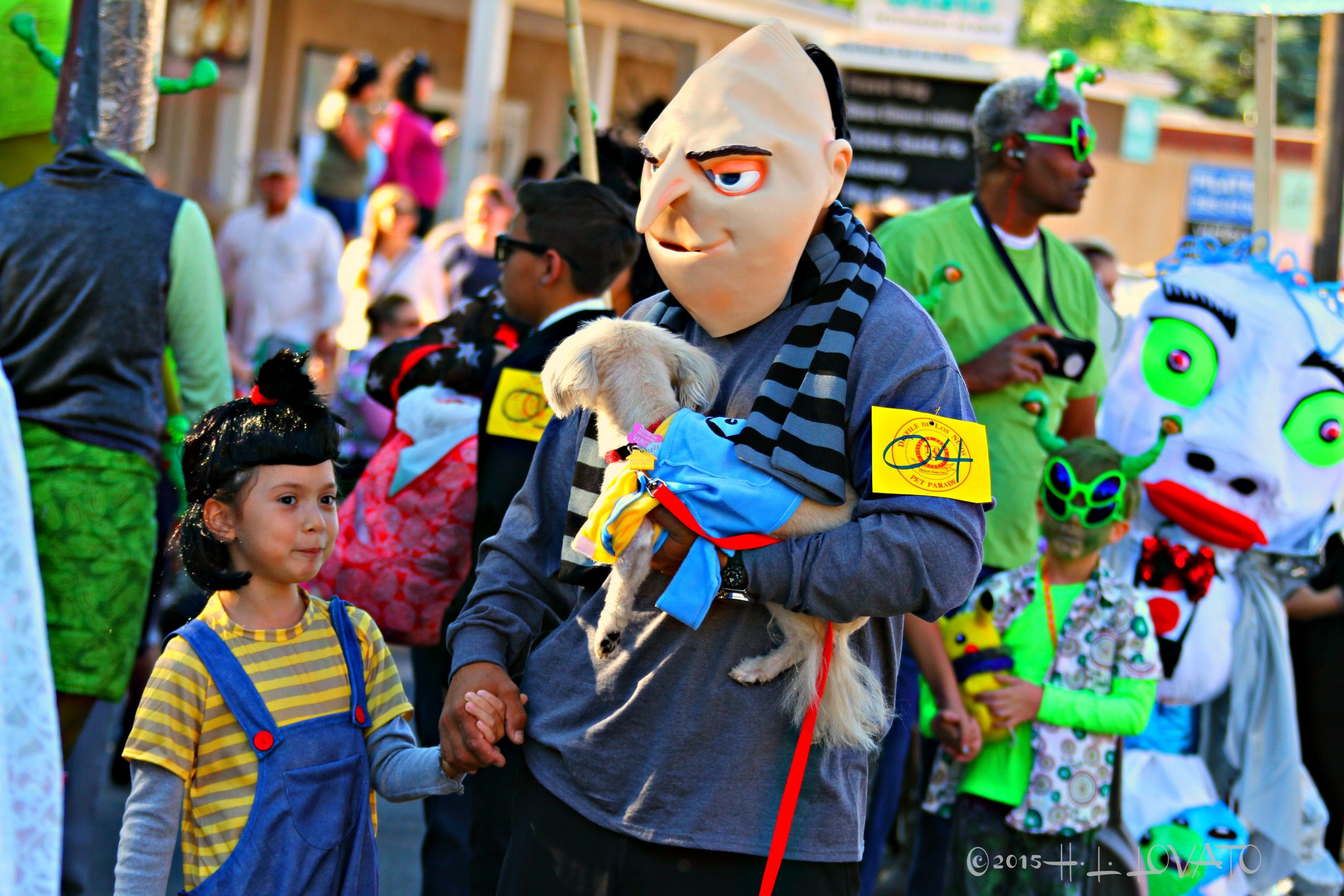 people in costume attending dog parade