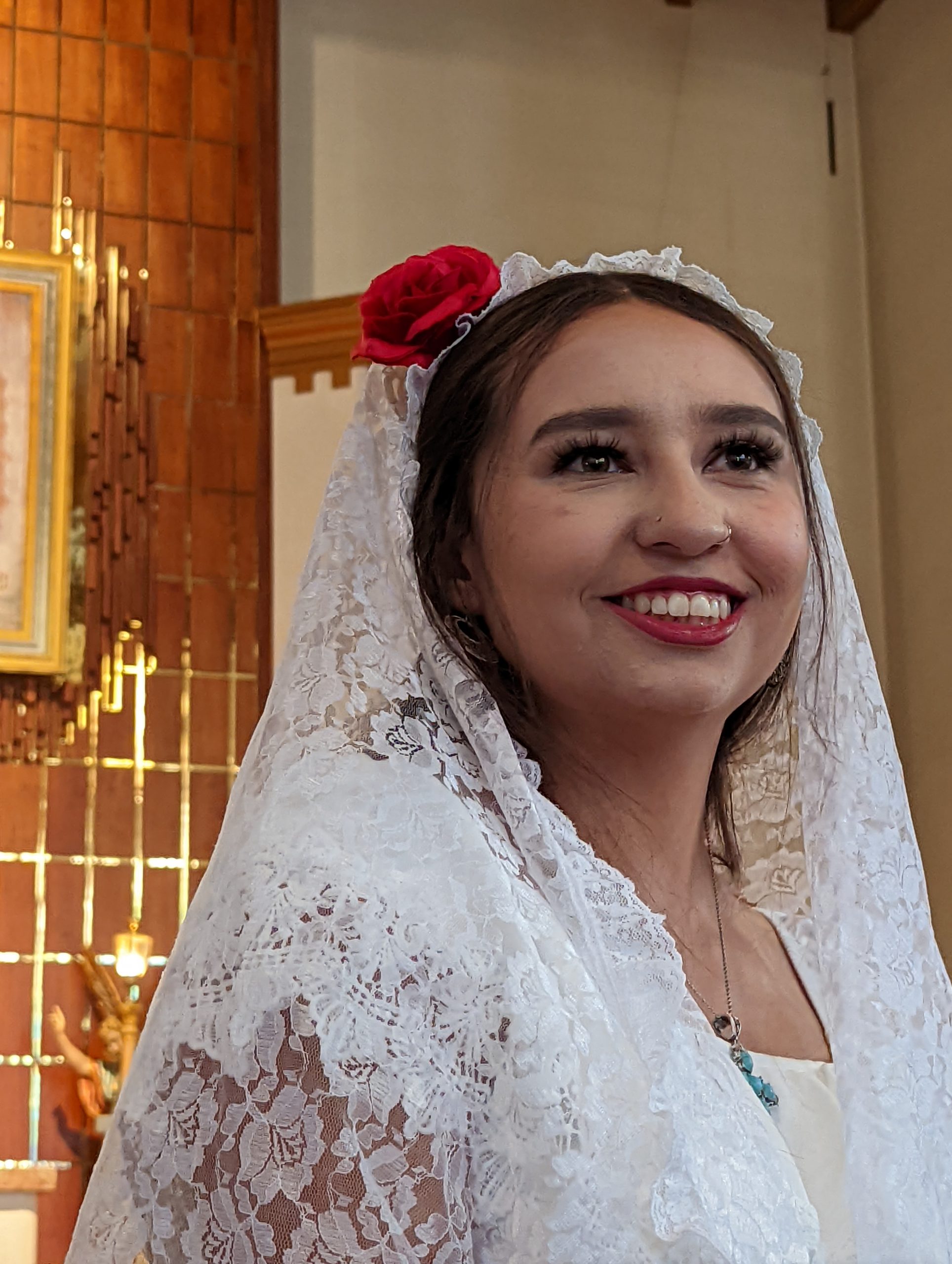 Woman smiling in a lace veil