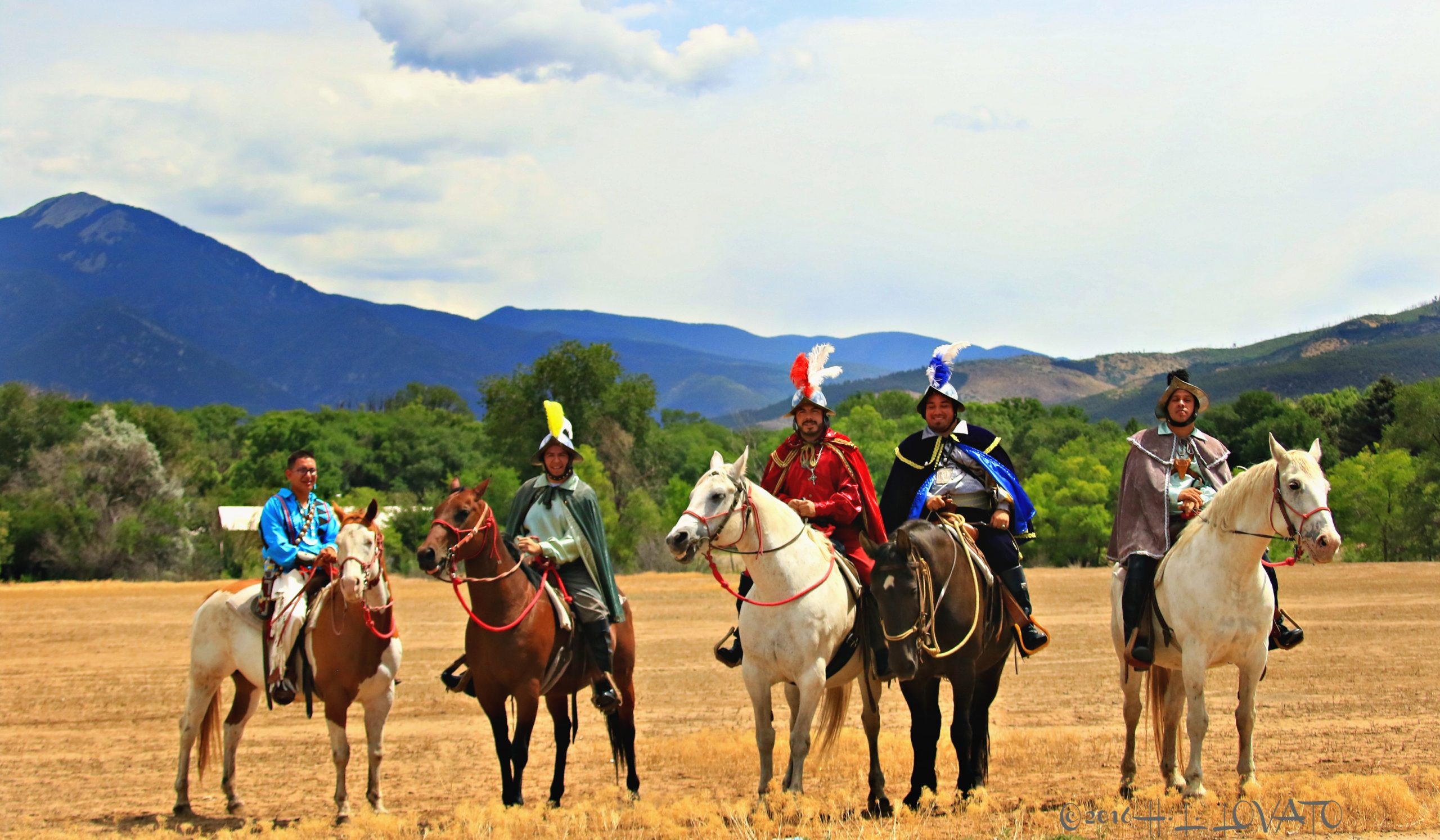Men on horses dressed as conquistadors
